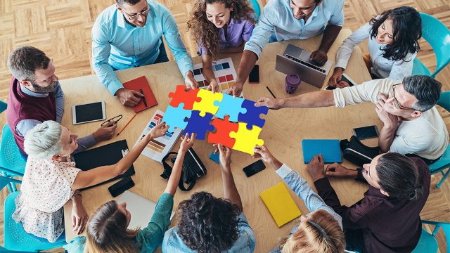 Work Team with Puzzle Pieces connected together