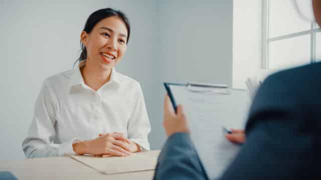 Young Asian businesswoman interviewing for a job while discussing the resume at office.