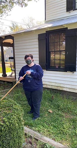Laura outside of the Weems-Botts House in Dumfries, VA, where she volunteers with Didlake
