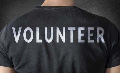 Volunteer benefiting from the value of volunteering with non-profit organizations.